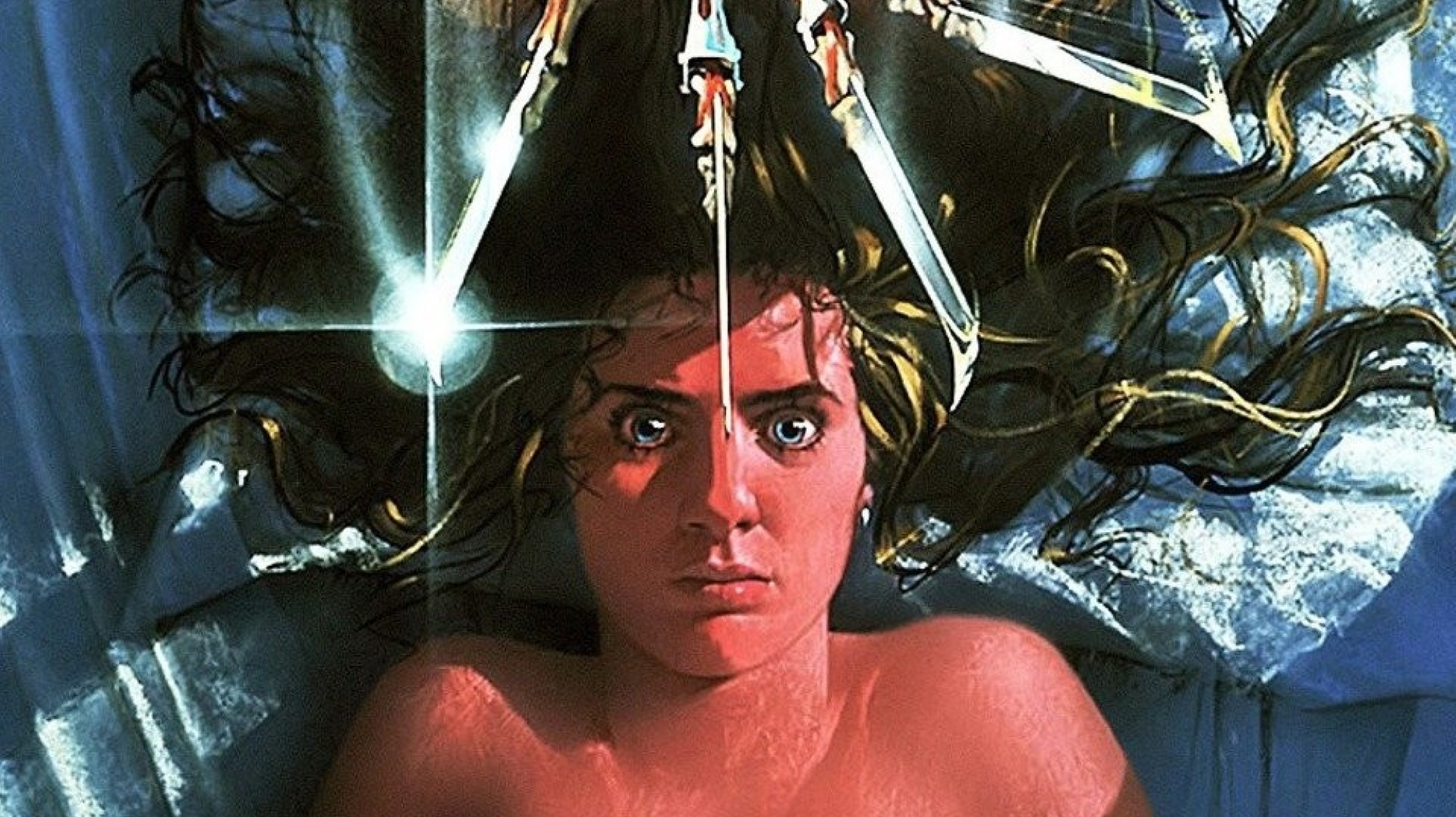 An image of the poster for A Nightmare on Elm Street, featuring a woman lying awake with a set of claws hanging above her.